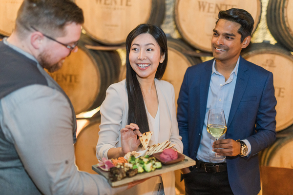 Wente Vineyards Corporate Event Promo board and models barrel room